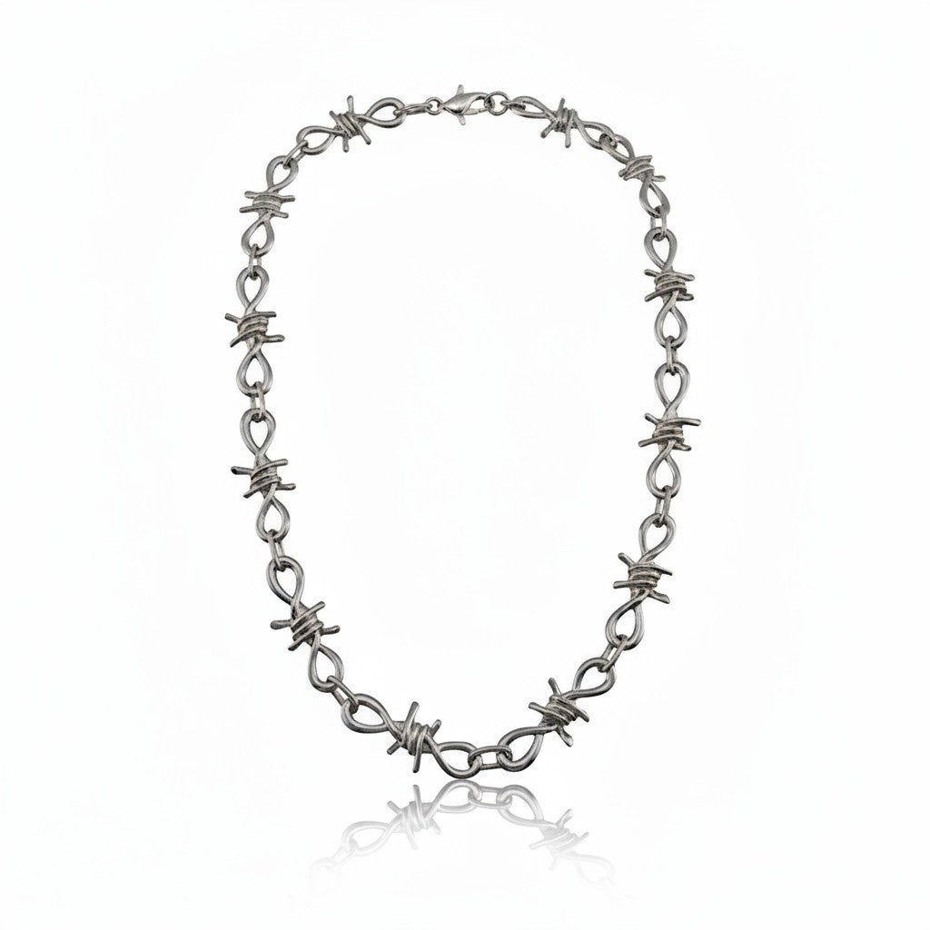 Maniac silver stainless steel barbed wire chain bracelet with infinity loop links.