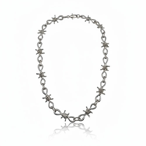 Maniac silver stainless steel barbed wire chain bracelet with infinity loop links.