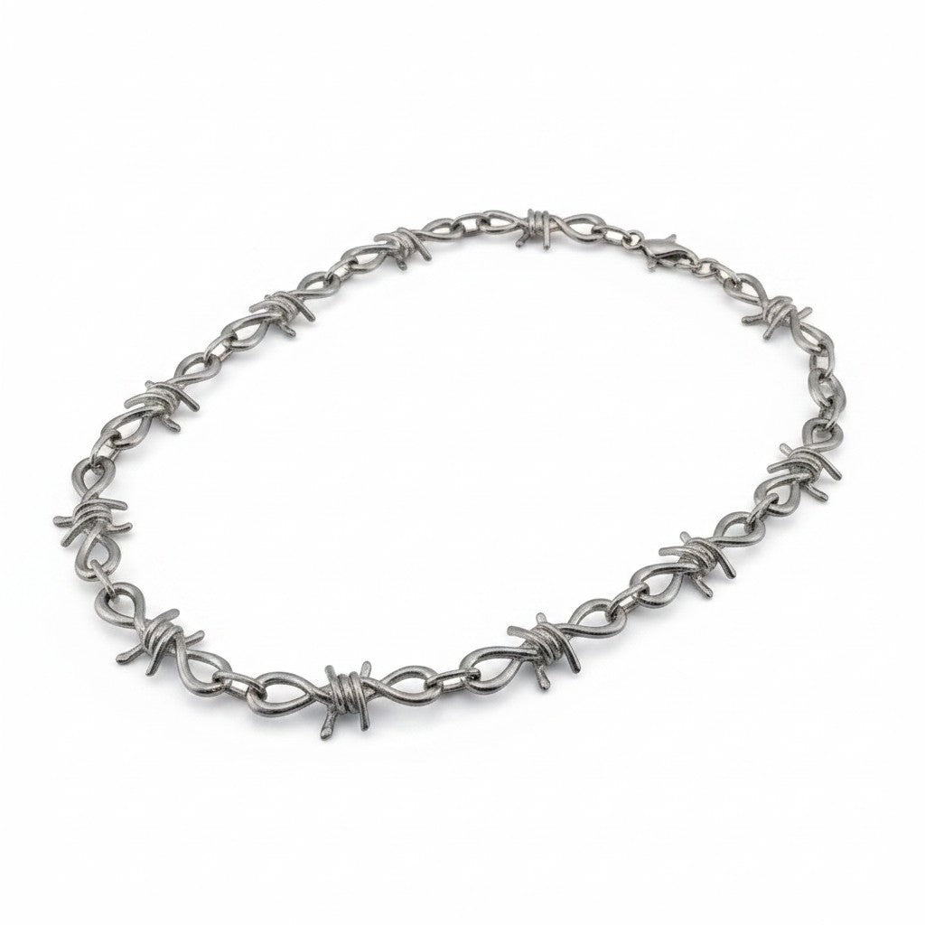 Maniac silver stainless steel barbed wire chain bracelet with infinity loop links.