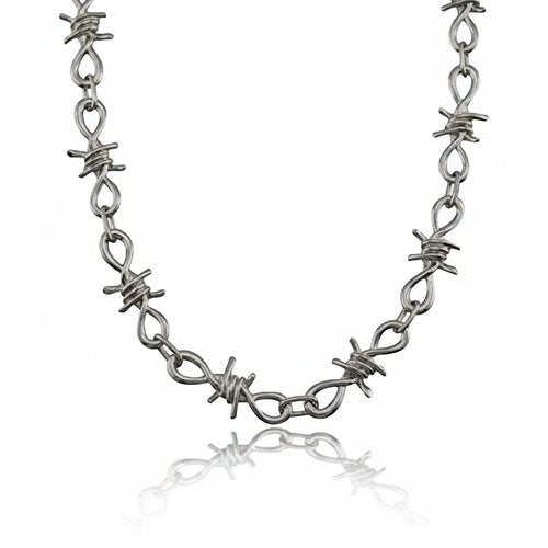 Maniac silver stainless steel barbed wire chain bracelet with intricate links and a punk aesthetic.