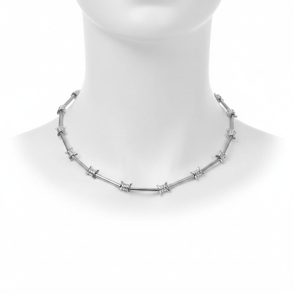 Maniac silver stainless steel barbed wire choker necklace with lobster clasp closure.
