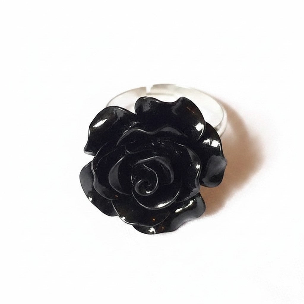 Maniac black resin rose flower ring with a silver-tone stainless steel band. Vintage gothic jewelry.