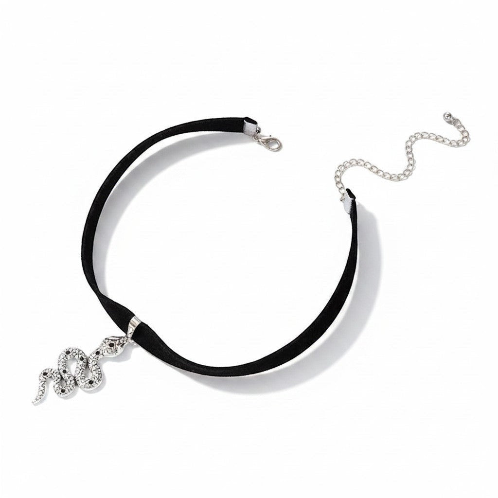 Maniac black velvet choker necklace with a silver snake pendant adorned with black stones. Gothic jewelry.