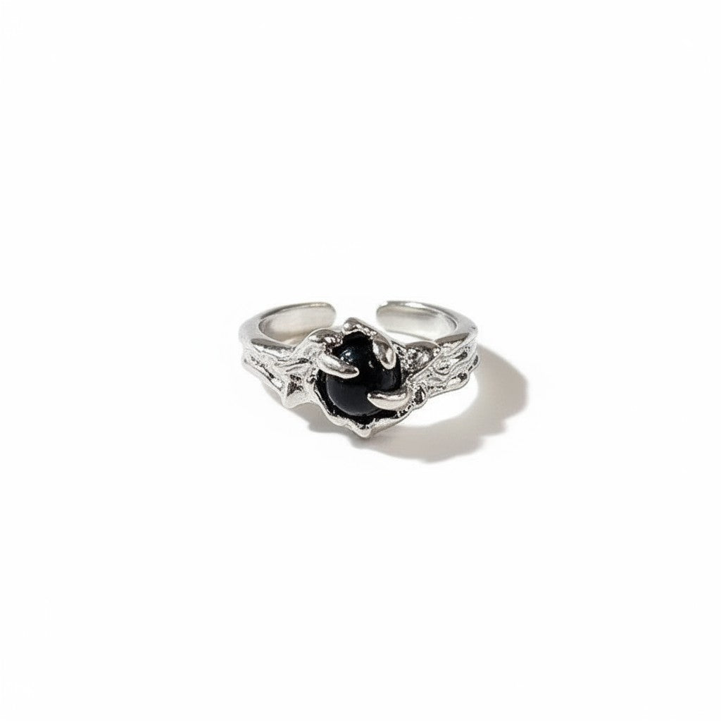 Maniac silver stainless steel ring with black rose design and textured band. Adjustable, unisex.