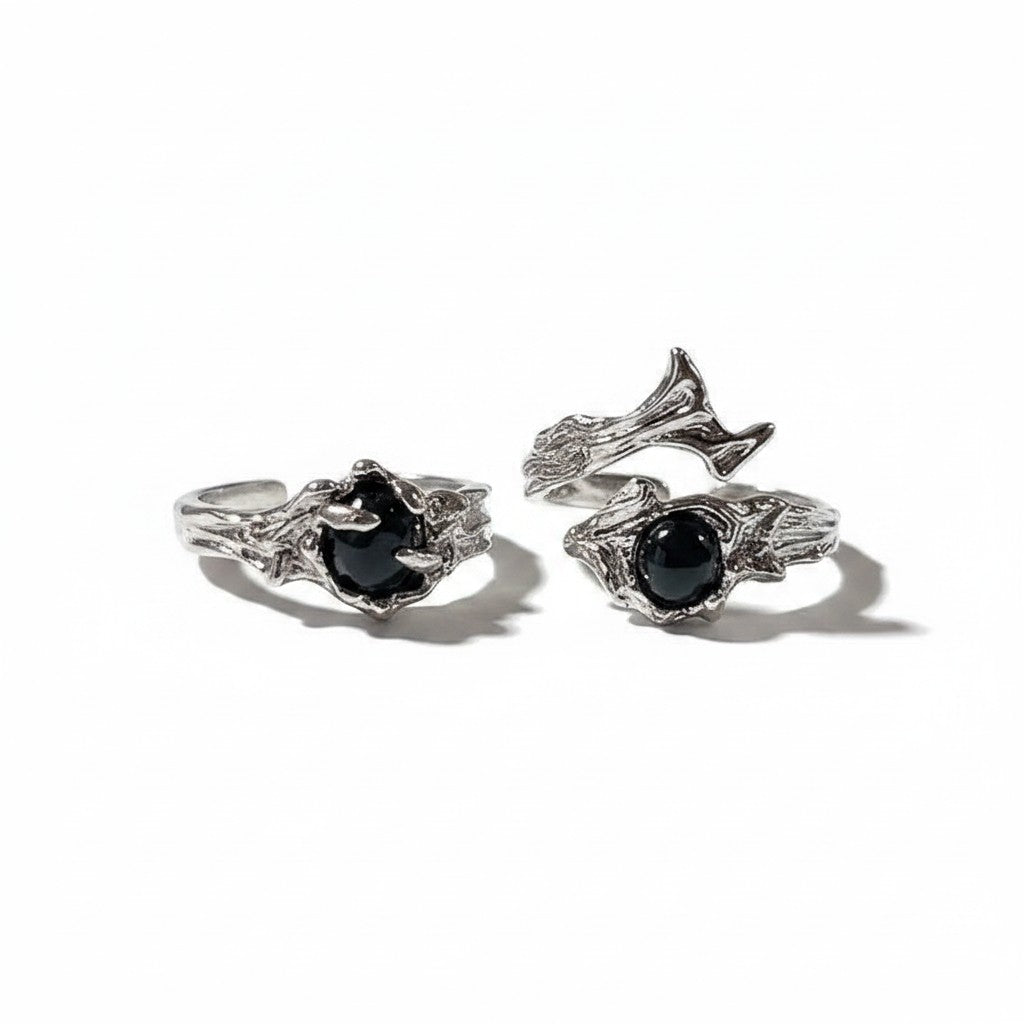 Maniac silver stainless steel rings with black stone, featuring a dark, textured, thorn-like design. Unisex style.