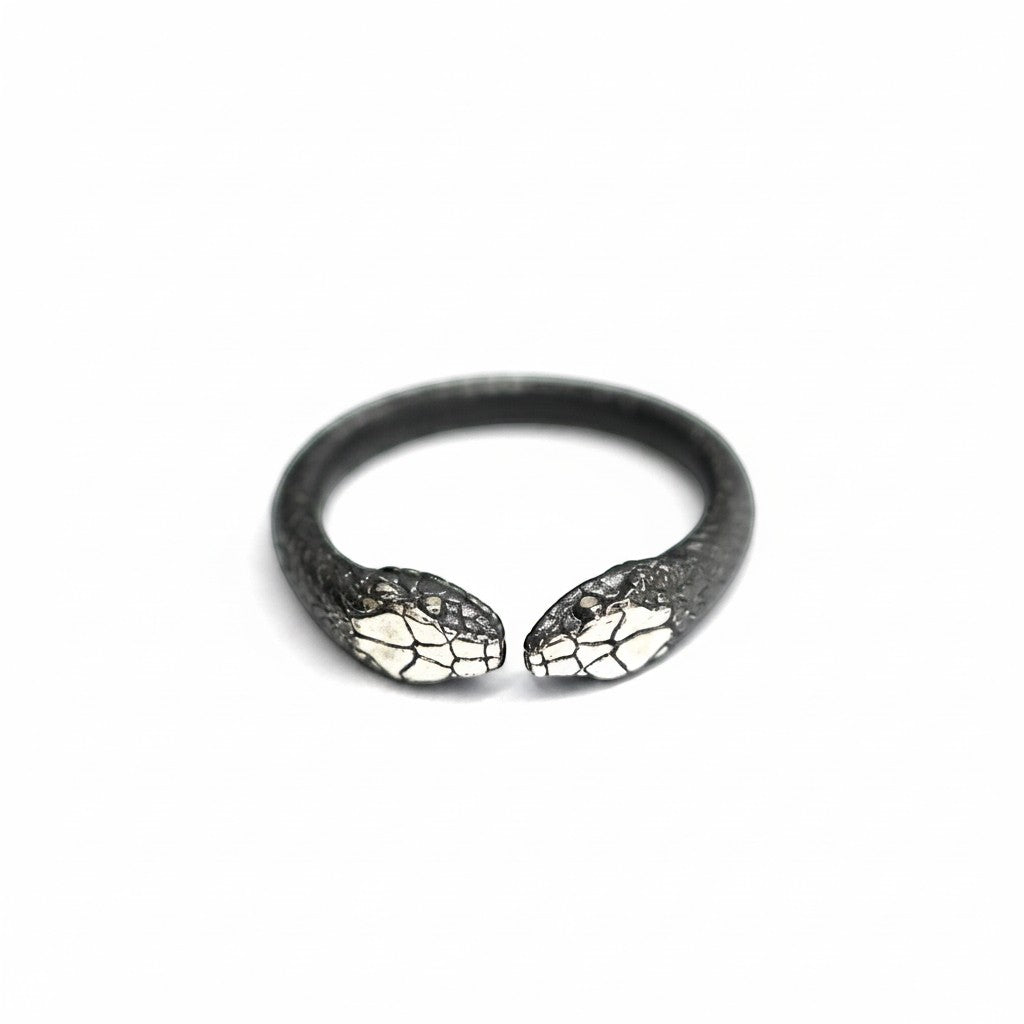 Maniac double snake ring in stainless steel with detailed scales and silver accents on heads.