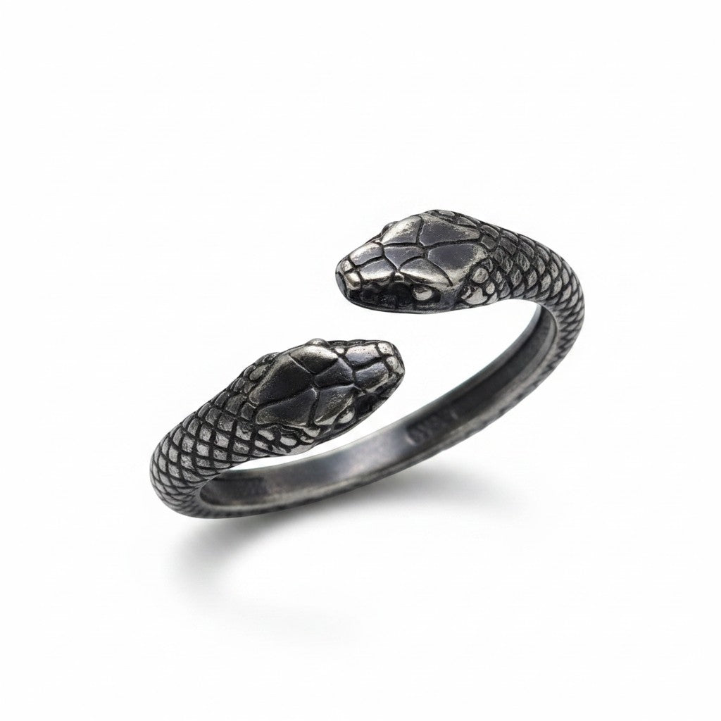 Maniac double snake ring in stainless steel with intricate scale detail on heads.