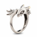 Maniac silver stainless steel ring designed as a small flying dragon with textured wings and gold accents.