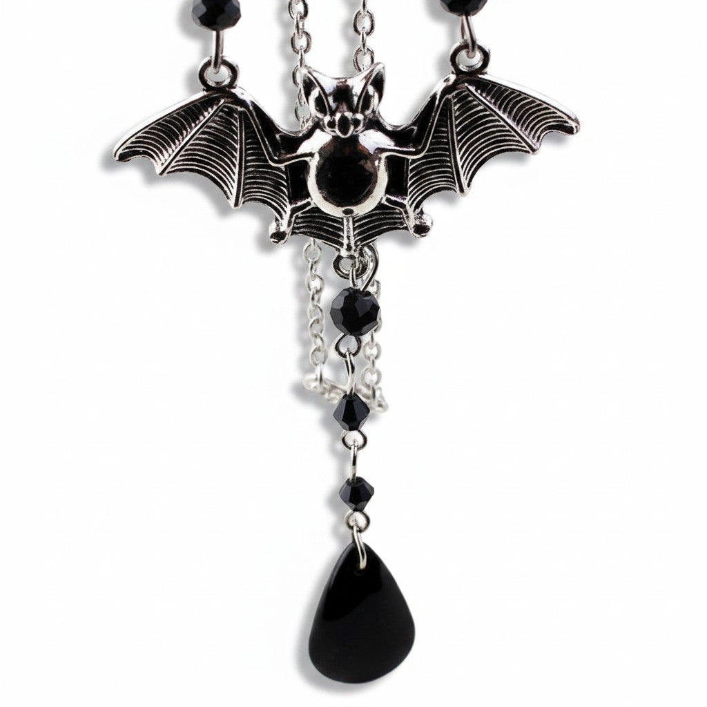 Maniac gothic bat necklace with black beads and teardrop charm, made of stainless steel.