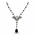 Maniac gothic bat necklace with black beads and a teardrop pendant. Stainless steel.
