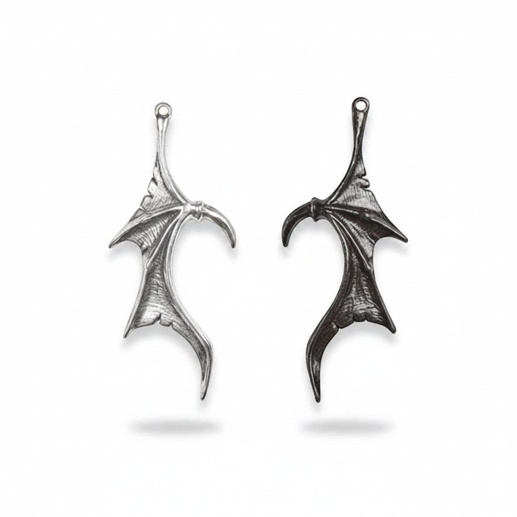 Maniac Gothic devil wing necklaces in silver and black stainless steel for couples. Punk bat wing design.