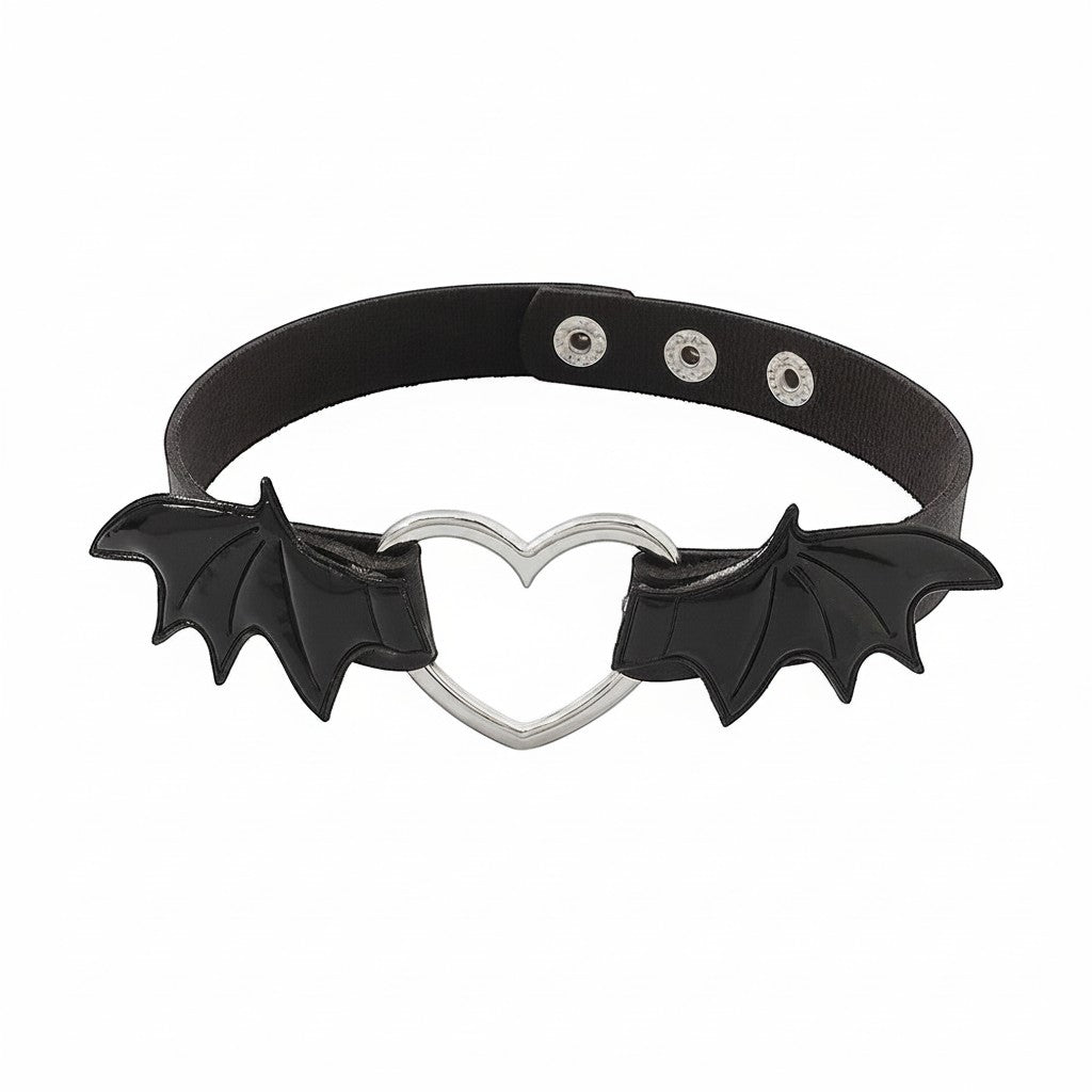 Maniac black faux leather choker with silver heart and bat wings, gothic punk style.