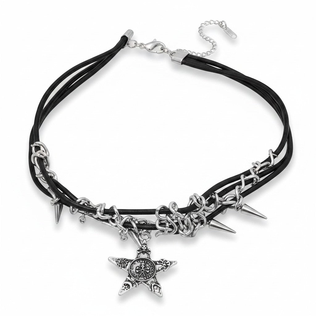 Maniac black faux leather choker necklace with silver star pendant, spikes, and chains. Gothic punk style.