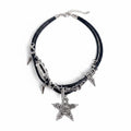 Maniac gothic punk necklace with black leather cords, silver chains, spikes, and a star pendant featuring skulls and rivets.