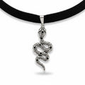 Maniac black velvet choker necklace with a silver snake pendant adorned with black stones.