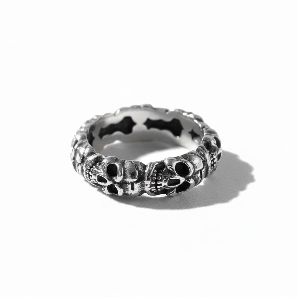 Maniac silver stainless steel ring with an ossuary skull design. Gothic jewelry.