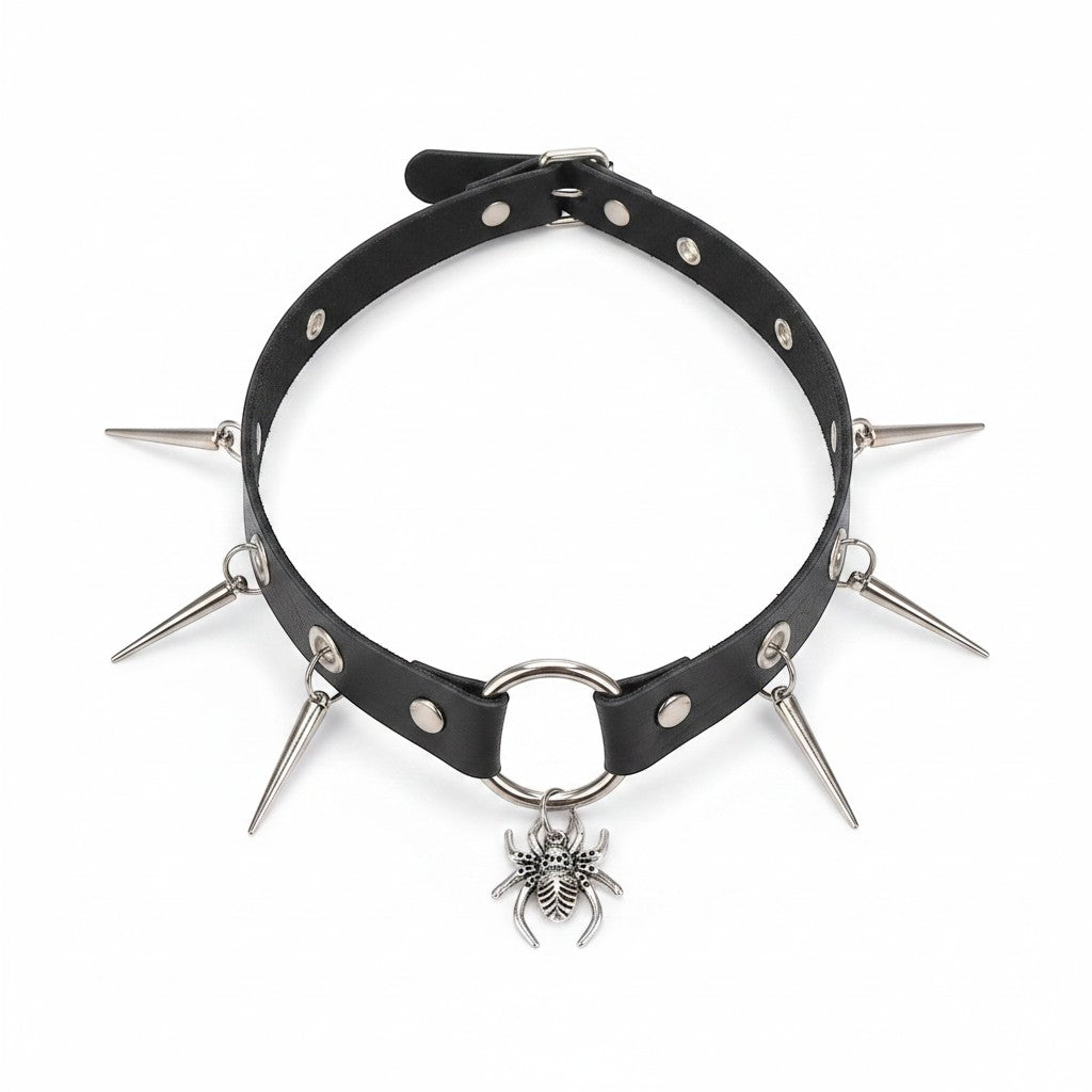 Maniac black faux leather choker necklace with silver spider and spike charms. Adjustable punk style.