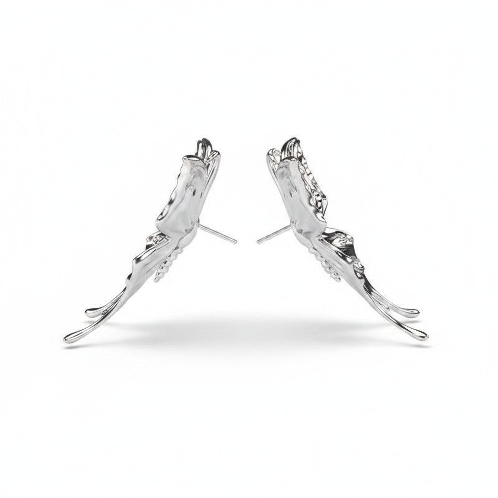 Maniac silver stainless steel three-dimensional butterfly earrings with a fluid, artistic design.
