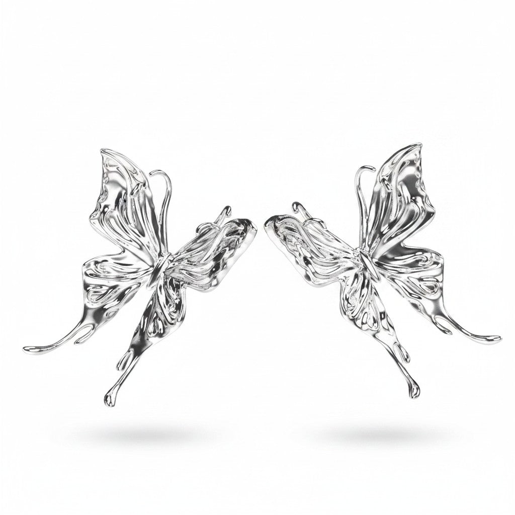 Maniac silver stainless steel three-dimensional butterfly earrings with intricate wing details.