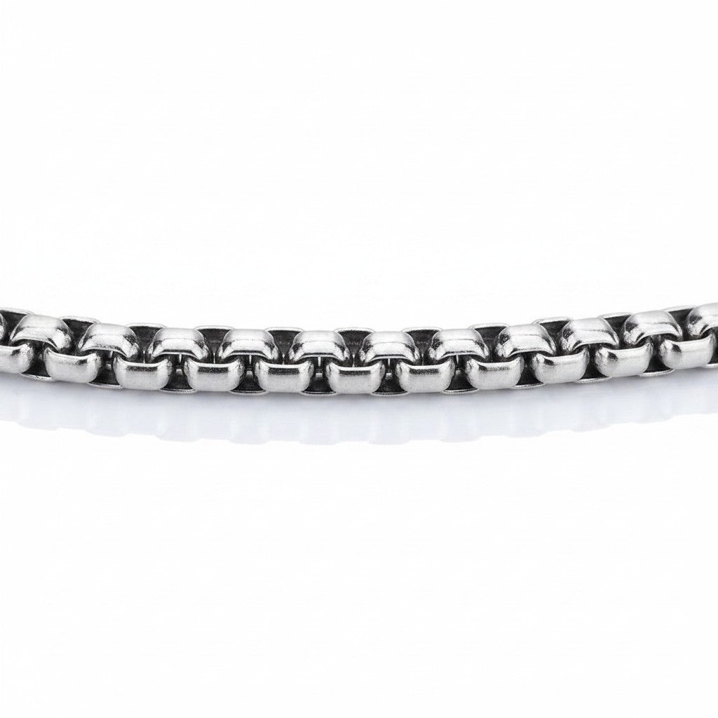 Maniac silver stainless steel gothic cross pendant necklace with ornate detailing. Unisex hip hop style.