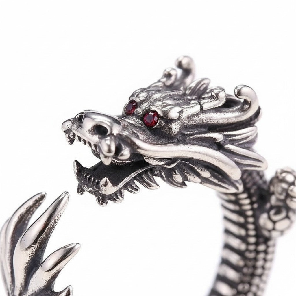 Maniac silver stainless steel dragon ring with red eyes, featuring intricate scales and claws. Retro style.
