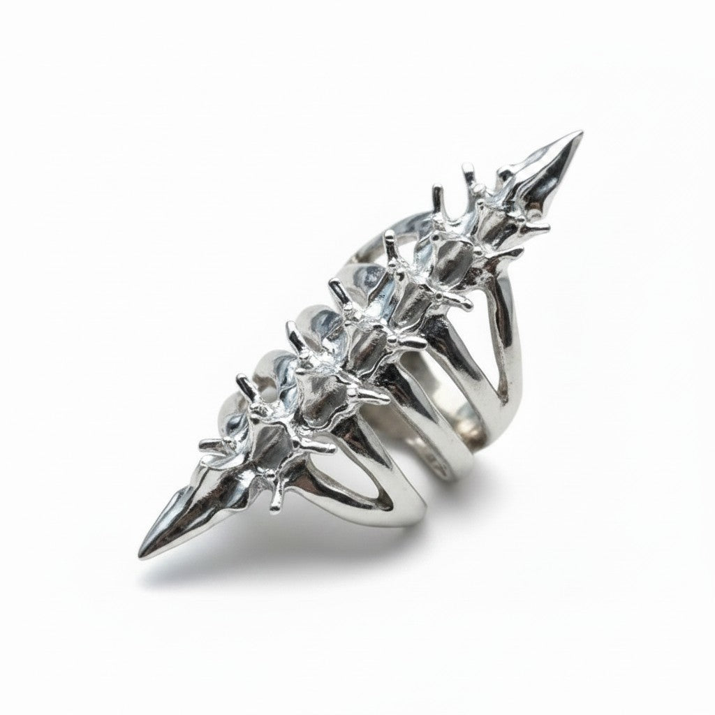 Maniac silver stainless steel full finger skeleton ring with gothic spike details.