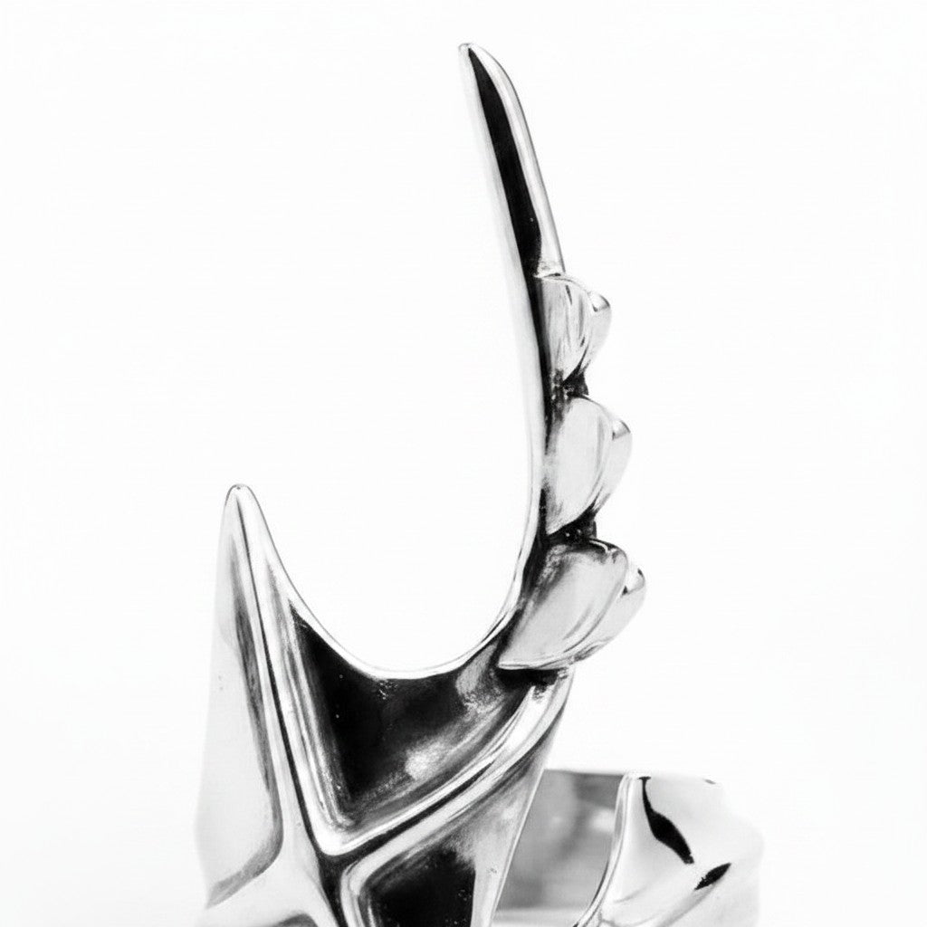 Maniac silver stainless steel irregular ring with a sharp, angular design and a unique, elongated shape.