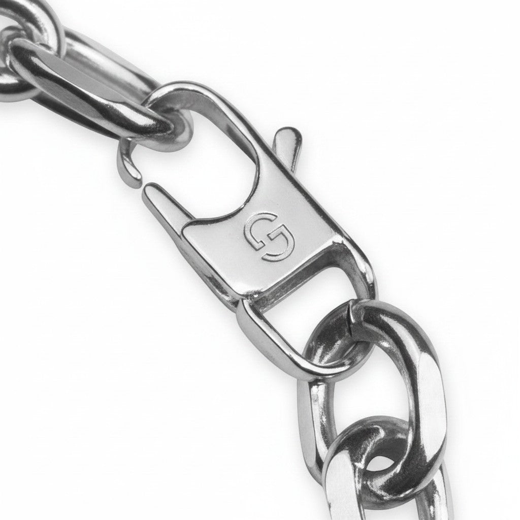 Maniac stainless steel oval link chain bracelet with a lobster clasp closure.