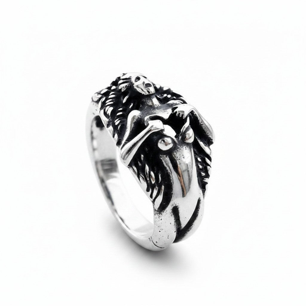 Maniac stainless steel men's ring with a detailed skull and skeletal figure design.