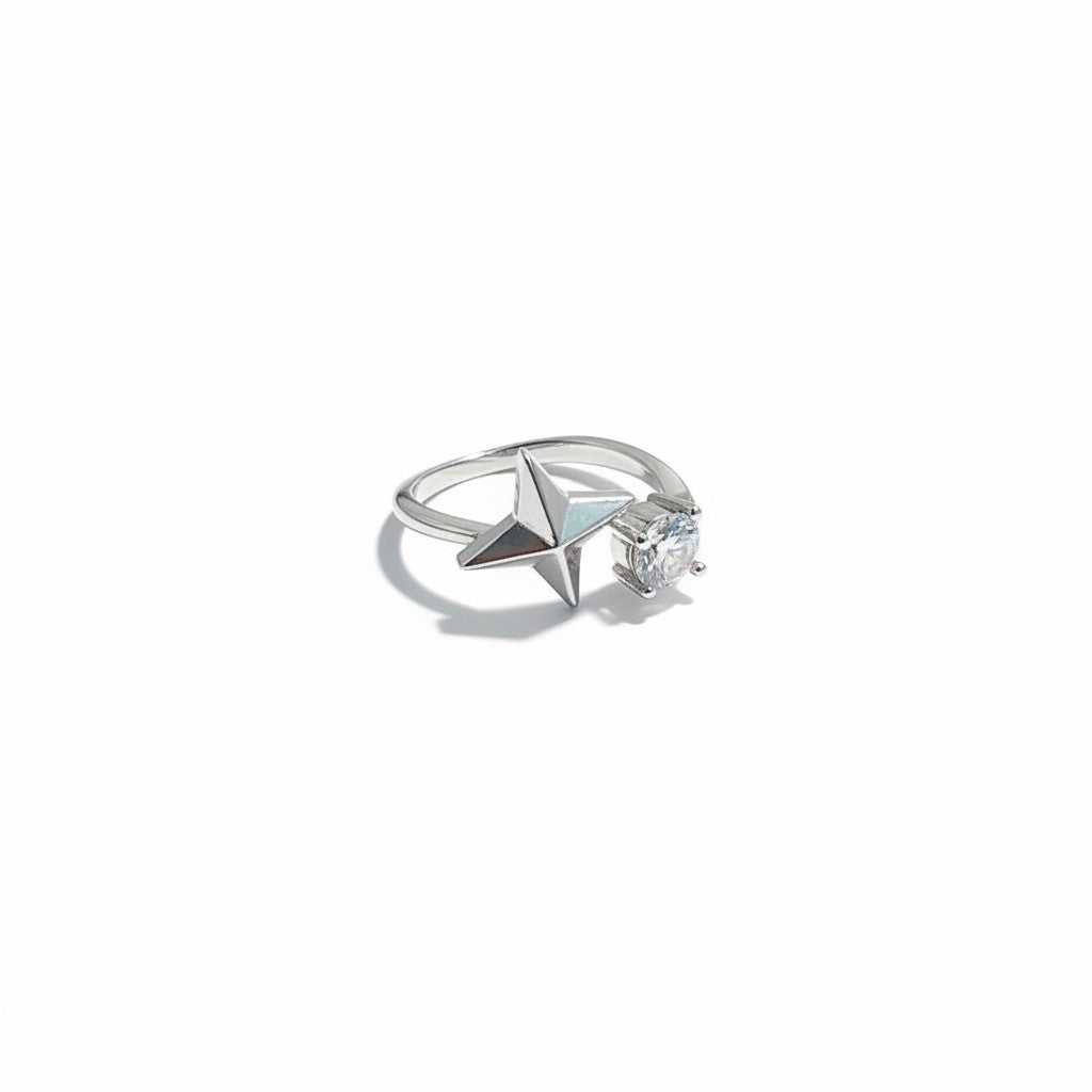 Maniac silver stainless steel ring with a sparkling diamond and a star design.
