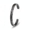 Maniac vintage Viking cuff bracelet in silver-tone titanium steel with engraved leaf pattern.