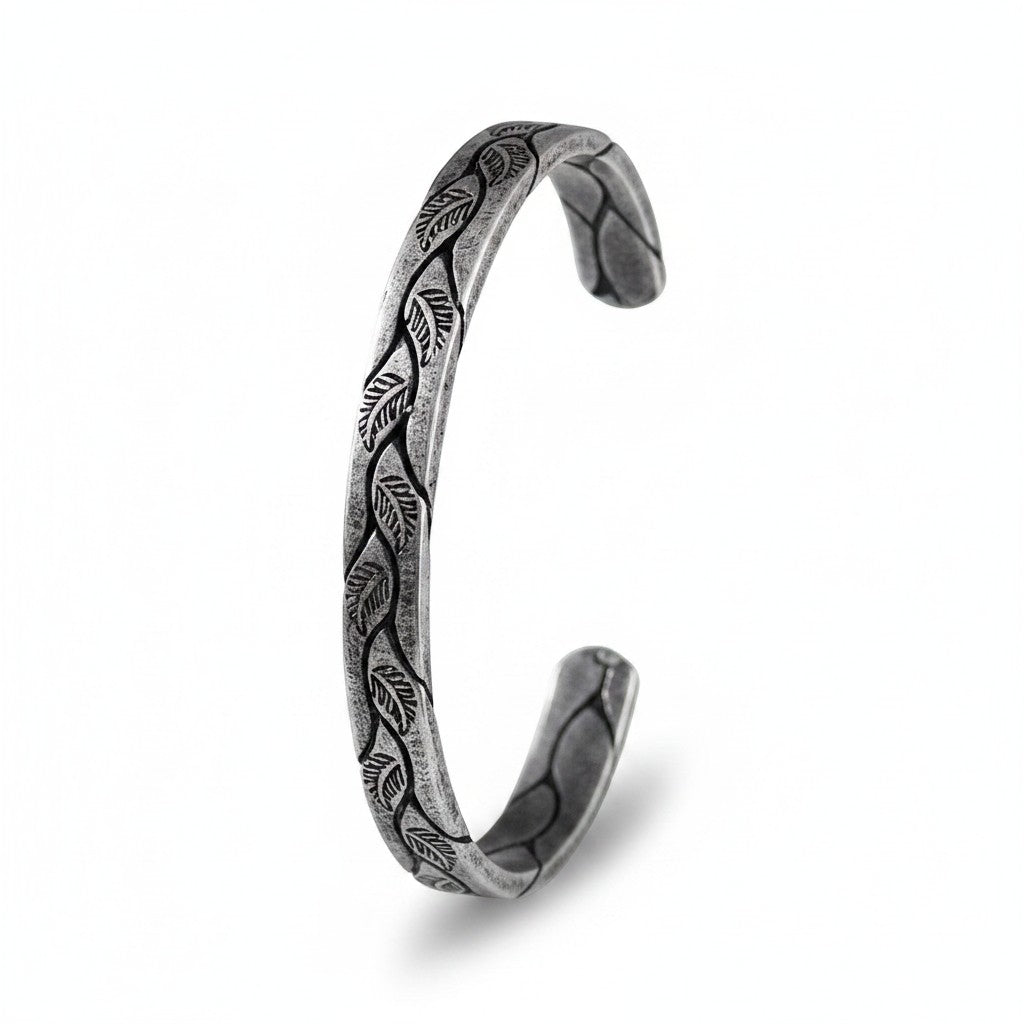 Maniac vintage Viking cuff bracelet in silver-tone titanium steel with engraved leaf pattern.